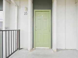 Front entrance with green door at Julian Square Apartments