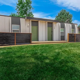 Julian Square Apartments exterior with green entry doors