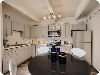 Kitchen with round dining table at Julian Square Apartments