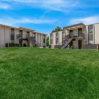Julian Square Apartments building exterior with lawn courtyard