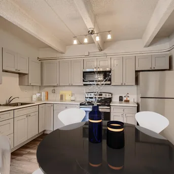 Julian Square Apartments kitchen with round dining table