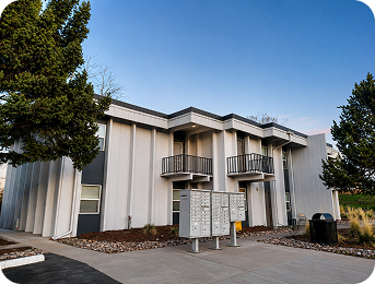 Exterior building and resident mailboxes at Julian Square Apartments